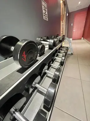 a row of dumbbells lined up in a gym at 2 Bed & 2 Bath at Beachwalk - Amazing View on 29th in Hallandale Beach