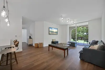 a living room with a couch and a table at Apartamento Aventura 3 habitaciones in Aventura
