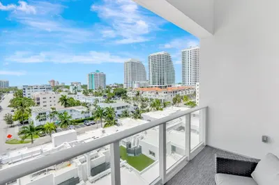 a balcony with a view of the city at Tiffany Topaz - Rooftop Pool, Gym, Walk to Beach in Fort Lauderdale