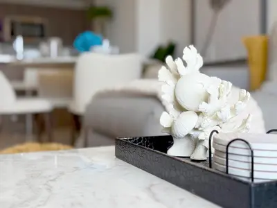 a white figurine sitting on top of a table at Tiffany Topaz - Rooftop Pool, Gym, Walk to Beach in Fort Lauderdale
