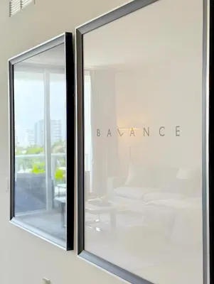 a glass window with a view of a room at Tiffany Topaz - Rooftop Pool, Gym, Walk to Beach in Fort Lauderdale