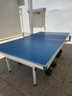 a ping pong table with a blue top on it at Lujoso Departamento Con VIstas Al Mar- Miami Beach in Sunny Isles Beach