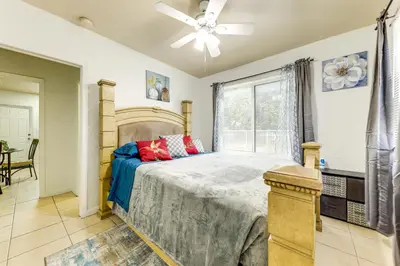 a bedroom with a large bed with a ceiling fan at 3 Mi to Beach Pet-Friendly Gem in Hollywood in Hollywood