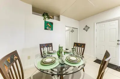 a dining room with a glass table and chairs at 3 Mi to Beach Pet-Friendly Gem in Hollywood in Hollywood