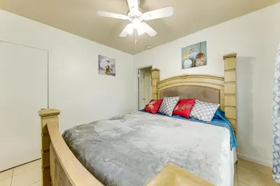 a bedroom with a bed and a ceiling fan at 3 Mi to Beach Pet-Friendly Gem in Hollywood in Hollywood