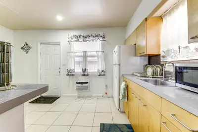 a kitchen with a sink and a refrigerator at 3 Mi to Beach Pet-Friendly Gem in Hollywood in Hollywood