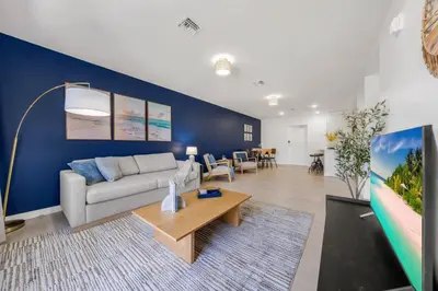 a living room with a couch and a table at New Spacious 3BR Apt With Rooftop Pool 2 Parking in Hollywood