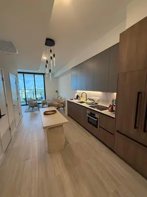 a large kitchen with a table and a living room at New 1Bed 1 bath Ocean view in Miami Beach