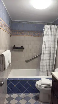 a bathroom with a tub and a toilet at Oceanview Studio at Castle Beach Club – Pool, Beach Access, Valet Parking, Gym & More! in Miami Beach