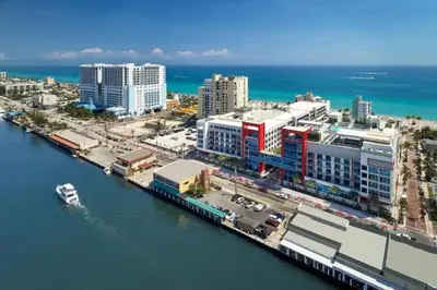 an aerial view of a city next to the water at New Luxury Beachfront Condo with Rooftop Pool in Hollywood