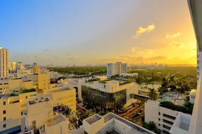 an aerial view of a city at sunset at Luxury Oceanview Suite at the Fontainebleau Miami Beach with Balcony, King & Sofa Bed in Miami Beach