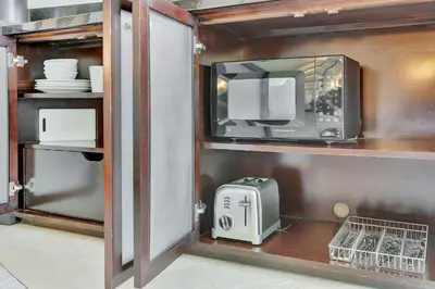 a kitchen with a microwave and a toaster at Luxury Oceanview Suite at the Fontainebleau Miami Beach with Balcony, King & Sofa Bed in Miami Beach