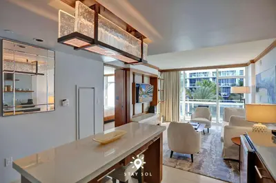 a kitchen and living room with a couch and a table at Spectacular 1-Bedroom Sea View Luxury & Comfort in Miami Beach