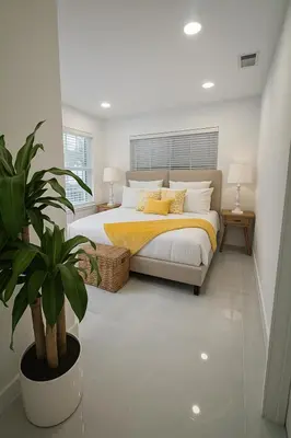 a bedroom with a bed and a potted plant at Hollywood Beach home in Hollywood