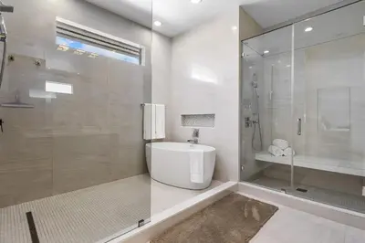 a bathroom with a shower and a tub and a sink at Riviera Reserve by Stay Awhile Villas in Fort Lauderdale