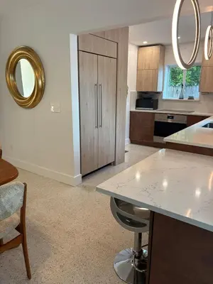 a kitchen with a table and a counter top at Mid-Century with Outdoor Oasis in Fort Lauderdale