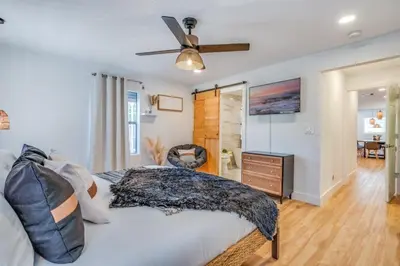 a bedroom with a bed and a ceiling fan at Fox Garden Luxury Boho Near Downtown & Beach home in Fort Lauderdale