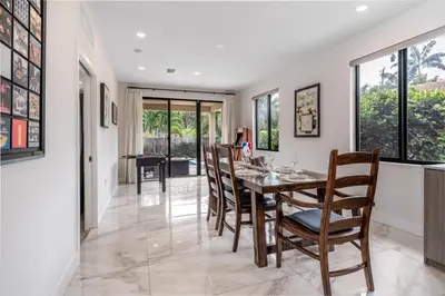 a dining room with a table and chairs at Fox Sonata Downtown Pool House home in Fort Lauderdale
