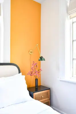 a bedroom with a bed and a table with a lamp at Designer 2br, king-size bed, 5mins to the beach J1 in Hollywood