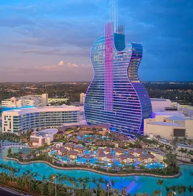 a hotel with a guitar shaped building with a resort at Designer 2br, king-size bed, 5mins to the beach J1 in Hollywood