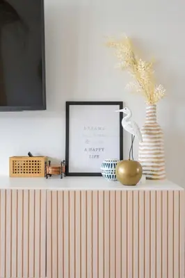a shelf with a picture and a bird on it at Stylish 2br apt, 5 mins to the BEACH J2 in Hollywood