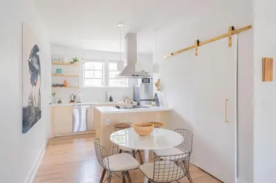 a kitchen with a table and chairs in a room at Stylish 2br apt, 5 mins to the BEACH J2 in Hollywood