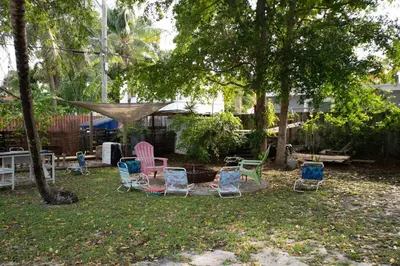a group of chairs sitting in a yard at Cozy 2br 5 mins drive to the beach j6 in Hollywood