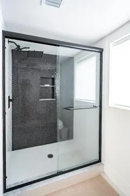 a glass shower in a bathroom with a toilet at Designer Gem Condo - 5 Mins to Sand, Playground, Tennis, Free Parking in Hollywood