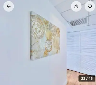 a room with a painting on the wall at Ocean reserve 2 bedroom plus den in Sunny Isles Beach