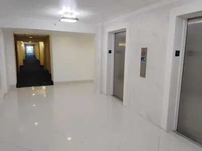 a hallway of an office building with white walls at Ocean reserve 2 bedroom plus den in Sunny Isles Beach
