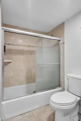 a bathroom with a toilet and a shower at Resort at Sunny Isles Beach with Ocean view in Sunny Isles Beach