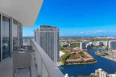 a balcony of a building with a view of a river at Stunning 1BR Apt With Ocean View Balcony in Hollywood