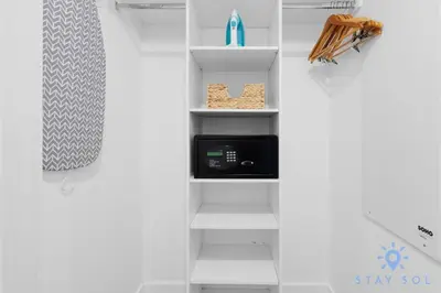 a white shelf with a microwave in a room at Coastal Retreat Modern Studio w Harbour Views in Hallandale Beach