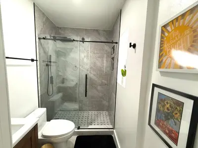 a bathroom with a shower and a toilet at The Pines Hideaway-Your Home Away from Home in Fort Lauderdale