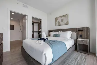 a bedroom with a large bed in a room at Ocean Dreams Chic 2BR Getaway Minutes from Miami's Top Attractions in Miami Beach