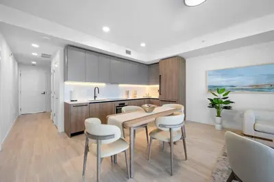 a kitchen with a table and chairs and a sink at NOK Fantastic 1 BR Den in Miami in Miami Beach