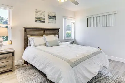 a bedroom with a large bed and a window at Game Day Made Easy Home 3 Mi to Hard Rock Stadium in Miami Gardens