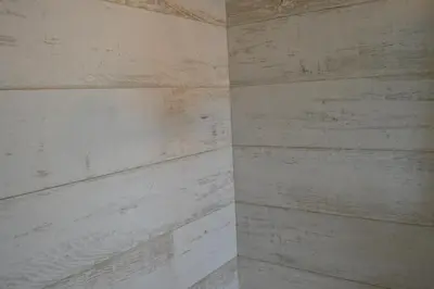a room with white wood paneling on a wall at WATERFRONT STUDIO COZY WITH WATERVIEWs in Miami Beach