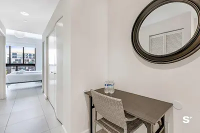 a dining room with a mirror and a table at Studio Apt in Downtown Doral in Miami
