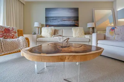 a living room with a wooden coffee table at Stunning Oceanfront 1BR in the 1 Hotel in Miami Beach