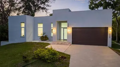 a white house with a garage at Villa Azul Luxe Retreat in Fort Lauderdale
