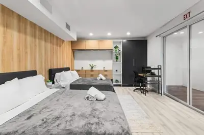 a bedroom with two beds and a desk at Brand new Luxurious Villa in Hollywood