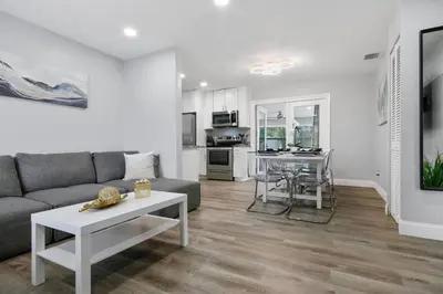 a living room with a couch and a table at Renovated Home in Hollywood in Hollywood