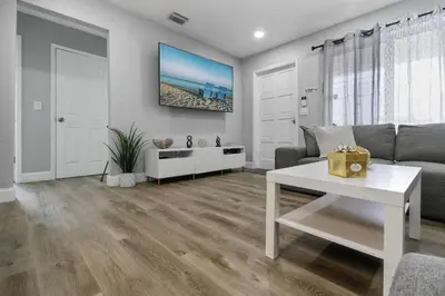 a living room with a couch and a table at Renovated Home in Hollywood in Hollywood