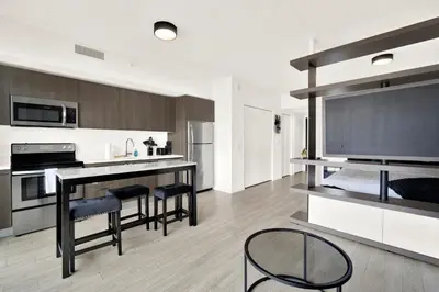 a kitchen with a table and chairs in a room at Elegant studio in the heart of downtown Miami in Miami