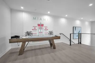 a bench in a room with a sign on the wall at Casa Amoret - Brand New Family-Friendly Retreat in Miami