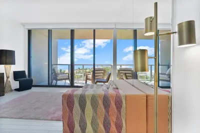 a living room with a view of a living room at Oceanfront Elegance at W Hotel in Miami Beach