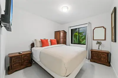 a white bedroom with a bed and a window at Oasis with Pool & Cold Plunge-Near Beach & Nightlife in Fort Lauderdale