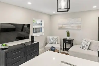 a living room with a tv and a couch at Perfect stay for 2-Walk to Wilton Drive-Shops &bars in Fort Lauderdale