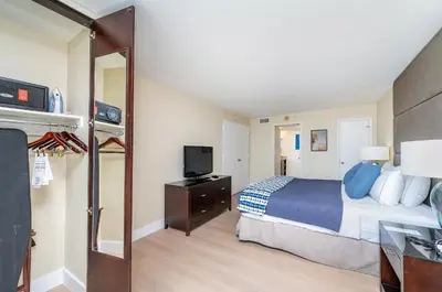 a hotel room with a bed and a television at Amazing Intracoastal Views - Walk to the Beach! in Fort Lauderdale